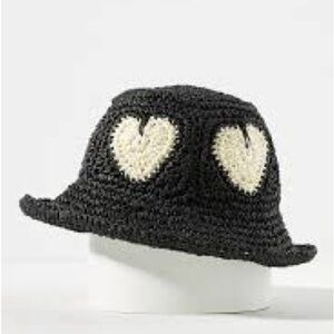 Anthropologie flexible Black Crochet Hat with Cream Hearts